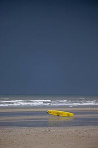 East Riding, Yorkshire, England; Surf rescue board lying on the foreshore
