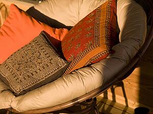 Lake of the Woods, Ontario, Canada; Bucket seat filled with cushions