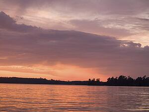 Lake of the Woods, Ontario, Canada; Twilight over still lake water