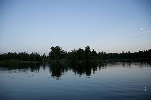 Lake of the Woods, Ontario, Canada; Sunset over placid lake