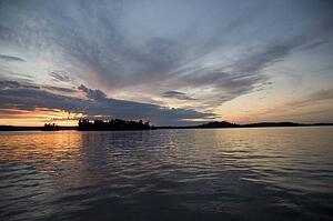 Lake of the Woods, Ontario, Canada; Dramatic sunset over lake