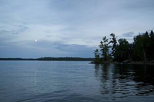 Lake of the Woods, Ontario, Canada; Moon rising above lake
