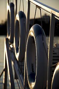 Kenora, Lake of the Woods, Ontario, Canada; Life preservers hanging on a dockside gangway