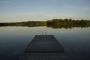 Lake of the Woods, Ontario, Canada; Pier looking out over lake toward forest