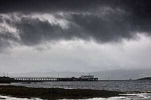 Islay, Scotland; Storm clouds over beach