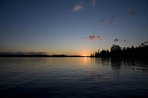 Lake of the Woods, Ontario, Canada; Sunset over placid lake
