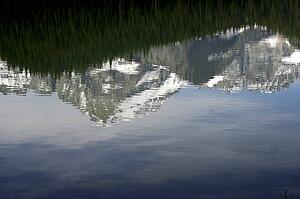 Swift Current lake reflecting Mount Gould, Glacier National Park, Montana, USA