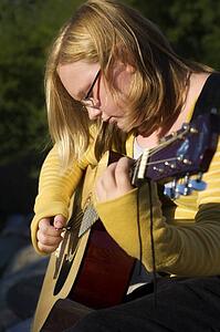 Teen playing guitar