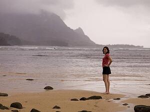 Woman standing by seashore, Hanalei Bay, Kauai, Hawaii, USA