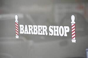Barber shop sign, Bracebridge, Ontario, Canada; Sign for a barber shop