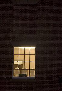 Three mannequins in an illuminated room