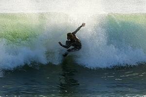 Surfer catching a wave