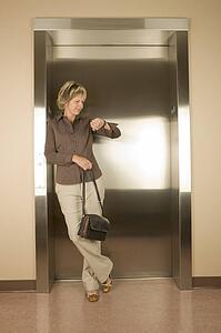 Woman waiting for an elevator