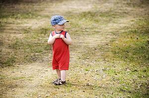 Child standing on a path