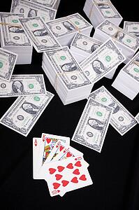 Piles of money and playing cards