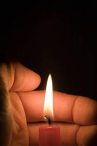 Hand and candle 