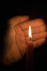 Hand and candle 