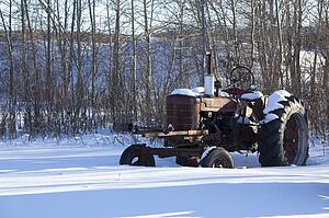Old tractor in the snow