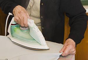 Housework; Older woman ironing