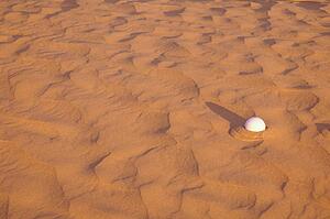 Golf ball lost in a sand trap
