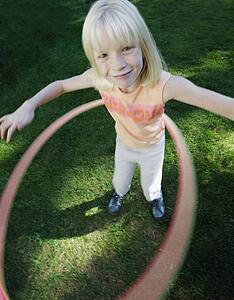 Child plays with hoop