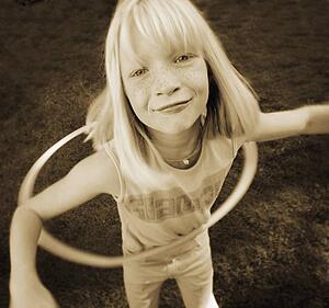Child plays with hoop