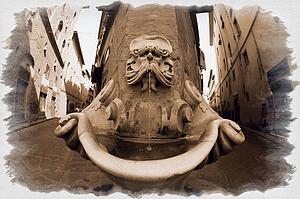 Carved ornamental fountain on a street in Florence, Tuscany Italy