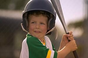 Portrait of Boy Wearing Baseball Uniform and Helmet Holding Bat