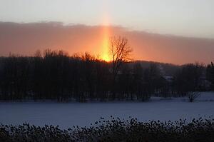 Beautiful sunrise behind a snow covered country town