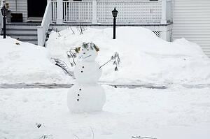 Snowman in a front yard