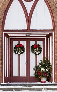 Church doors adorned with Christmas decorations
