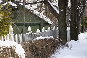Snow covered garden and barn