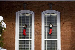 Christmas stockings hanging outside a house