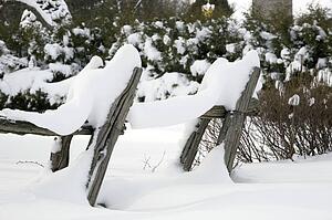 Old wooden fence covered in snow