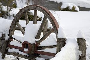Wooden carriage covered in snow