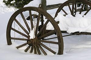 Wooden carriage covered in snow