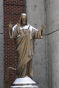 Sculpture of Jesus Christ covered in snow