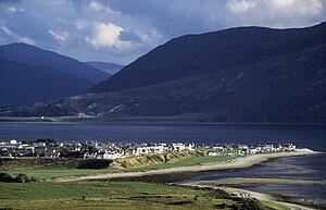Ullapool, Scottish Highlands, Scotland, United Kingdom; Quaint village and Loch Broom, beneath mountain range
