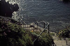 Devon, England, United Kingdom; Rough stone steps leading down to the sea
