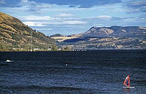 Clarkston, Idaho, USA; Man windsurfing down a river