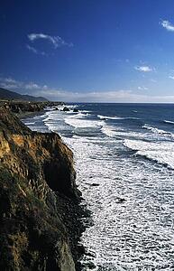 California, USA; Waves crashing against cliffs