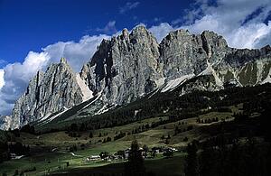 Italy; Rock formations towering over houses