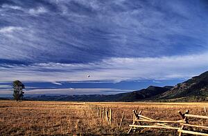 Wyoming, USA; Hot air balloon flying across the Grand Tetons