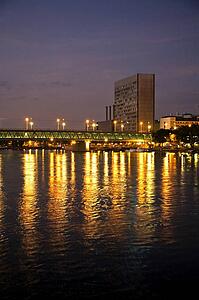 Rhine, Germany; Buildings and city lights reflected in the river