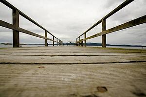 British Columbia, Canada; Surface level view of wooden dock, with a view into land