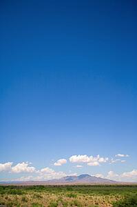 New Mexico, USA; Desert landscape with the Manzano Mountains in the distance