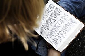 Woman reading the Bible
