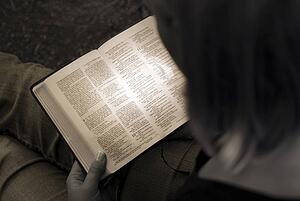Woman reading the Bible