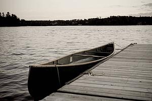Canoe at dock, Lake of the Woods, Ontario, Canada