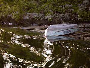 Lake of the Woods, Ontario, Canada; Boat on a dock 